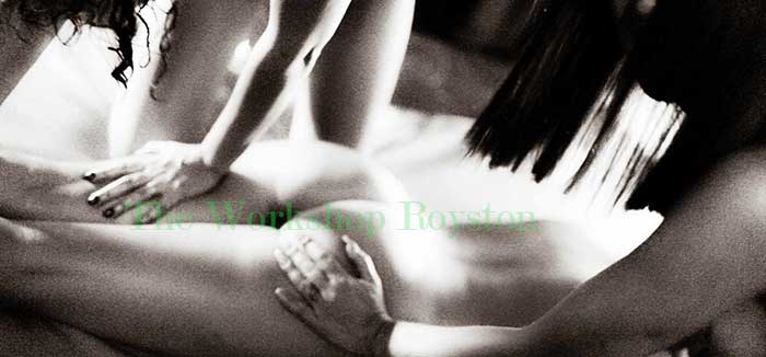 roxanne and jessica applying a 4 hand massage to a client at the workshop naturist spa royston